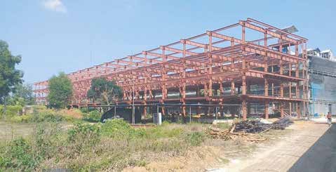 Peoples Poultry Ltd — Steel Buildings — multi-story frame under erection, second building